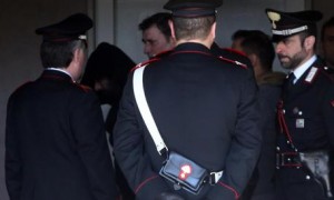 Claudio Giardiello (in the center, he wears a white shirt), the man who opened fire on in a Milan court, at Carabinieri's station in Vimercate, near Milan, Italy, 9 April 2015. At least four people were killed in Thursday's shooting at Milan's courthouse, investigative sources said.<br /><br /><br /><br />
ANSA / MATTEO BAZZI